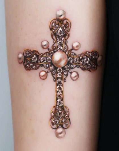 Whimsical crown Cross tattoo