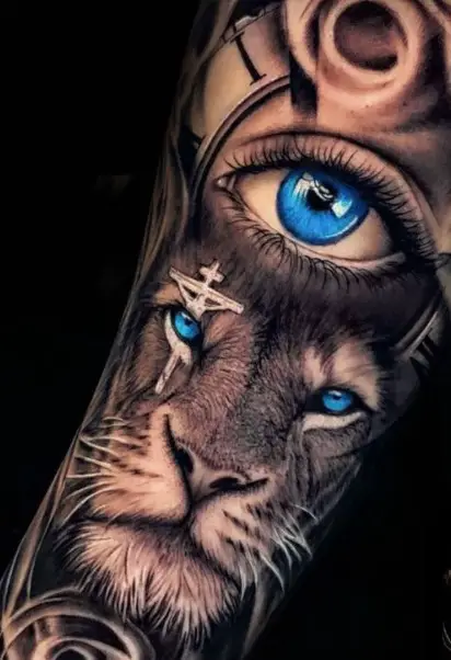 Lion with Blue eyes and cross tattoo