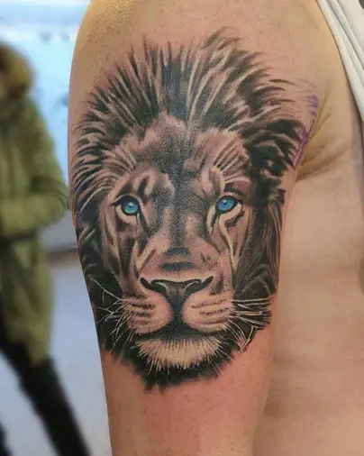 Simple Lion with Blue eyes tattoo 