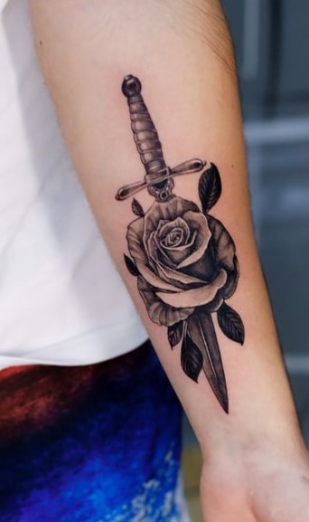 Dagger And Rose tattoo on arm